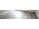 Light gray wood floor with white baseboard molding at 11143 Aliyah Dr, Hampton, GA 30228