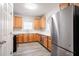 Kitchen features stainless steel appliances, wood cabinets, and updated countertops at 11143 Aliyah Dr, Hampton, GA 30228