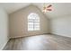 Main bedroom with vaulted ceiling, hardwood floors, and large window with lots of light at 11143 Aliyah Dr, Hampton, GA 30228