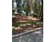 A wooded backyard with a partially constructed concrete patio area at 1808 Brewer Sw Blvd, Atlanta, GA 30310