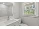 Bathroom featuring a modern vanity and window at 1808 Brewer Sw Blvd, Atlanta, GA 30310