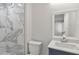 Modern bathroom with marble shower and stylish vanity at 1808 Brewer Sw Blvd, Atlanta, GA 30310