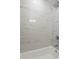 Stylish bathtub with marble tiling at 1808 Brewer Sw Blvd, Atlanta, GA 30310