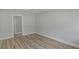 Neutral bedroom with durable wood-look floors, a spacious closet, and fresh paint throughout at 1808 Brewer Sw Blvd, Atlanta, GA 30310