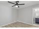 A bedroom featuring laminate flooring, neutral paint and ceiling fan at 1808 Brewer Sw Blvd, Atlanta, GA 30310