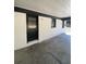 Carport with a clean, painted brick exterior and black trim, providing a sheltered parking space at 1808 Brewer Sw Blvd, Atlanta, GA 30310