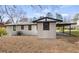 Backyard view of home with modern paint job and carport at 1808 Brewer Sw Blvd, Atlanta, GA 30310