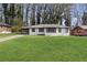 Single story house featuring a well manicured lawn, carport and a freshly painted exterior at 1808 Brewer Sw Blvd, Atlanta, GA 30310
