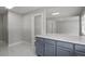 Modern kitchen with gray cabinets, quartz countertops, and open floorplan at 1808 Brewer Sw Blvd, Atlanta, GA 30310