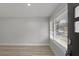 Modern living room featuring light-colored floors, neutral paint, and large windows that bring in natural light at 1808 Brewer Sw Blvd, Atlanta, GA 30310
