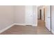 Neutral bedroom featuring modern gray flooring and bright white door and baseboards at 4950 Summersun Dr, Morrow, GA 30260