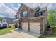 View of a beautiful two-story home with an attached two car garage at 4950 Summersun Dr, Morrow, GA 30260