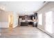 Open-concept kitchen with dark cabinetry, stainless steel appliances, and an island at 4950 Summersun Dr, Morrow, GA 30260
