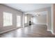Open living space with hardwood floors, neutral walls, and a fireplace at 4950 Summersun Dr, Morrow, GA 30260
