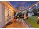 The outdoor patio, complete with a pergola and dining space, extends from the home with double french doors at 541 Benmac Se Rd, Smyrna, GA 30080