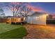 A spacious backyard with an outdoor seating area, and a large artificial turf lawn, perfect for outdoor activities at 541 Benmac Se Rd, Smyrna, GA 30080