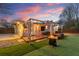 Outdoor living space with a cozy fire pit, pergola, and artificial turf creates a relaxing and inviting atmosphere at 541 Benmac Se Rd, Smyrna, GA 30080