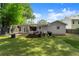 Backyard with patio, artificial turf, privacy fence and the exterior of the house at 541 Benmac Se Rd, Smyrna, GA 30080