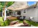Backyard featuring outdoor furniture, a covered patio, artificial turf and a privacy fence at 541 Benmac Se Rd, Smyrna, GA 30080