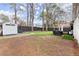 Spacious backyard featuring a storage shed and an outdoor grill at 541 Benmac Se Rd, Smyrna, GA 30080