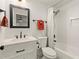 Clean bathroom with a white vanity, tiled shower, and contemporary finishes at 541 Benmac Se Rd, Smyrna, GA 30080