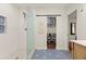 Bright bathroom featuring a glass shower, patterned floor, and a closet with shoe storage at 541 Benmac Se Rd, Smyrna, GA 30080