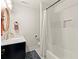 Elegant bathroom with a marble-top vanity, tiled shower, and modern fixtures at 541 Benmac Se Rd, Smyrna, GA 30080