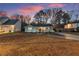 Well-kept single-Gathering home with a cozy front porch and manicured lawn at 541 Benmac Se Rd, Smyrna, GA 30080