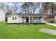 Charming single-story home with a well-manicured lawn and inviting front porch at 541 Benmac Se Rd, Smyrna, GA 30080