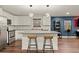 Stylish kitchen featuring stainless steel appliances, a large center island, and modern lighting fixtures at 541 Benmac Se Rd, Smyrna, GA 30080