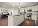 Bright and modern kitchen with a center island, stainless steel appliances, and ample counter space at 541 Benmac Se Rd, Smyrna, GA 30080