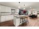 Open-concept kitchen with a center island, stainless steel appliances, and seamless flow to the living area at 541 Benmac Se Rd, Smyrna, GA 30080