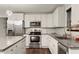 Modern kitchen boasts stainless steel appliances, sleek countertops, and stylish white cabinetry at 541 Benmac Se Rd, Smyrna, GA 30080