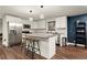 Modern kitchen with stainless steel appliances, a center island with seating, and stylish pendant lighting at 541 Benmac Se Rd, Smyrna, GA 30080