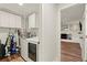 Bright laundry room features modern appliances and ample storage cabinets at 541 Benmac Se Rd, Smyrna, GA 30080