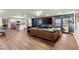 Expansive living area with sleek hardwood floors, modern furnishings, and an open kitchen at 541 Benmac Se Rd, Smyrna, GA 30080