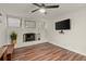 Living room with a fan and painted brick fireplace at 541 Benmac Se Rd, Smyrna, GA 30080
