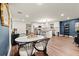 Open-concept living space with a modern kitchen, dining area, and stylish decor, offering seamless living at 541 Benmac Se Rd, Smyrna, GA 30080