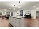 Expansive open-concept living space with a modern kitchen, dining area, and comfortable seating at 541 Benmac Se Rd, Smyrna, GA 30080