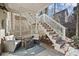 Outdoor patio area with comfortable seating, with stairs leading to the upper level at 8540 Hope Mews Ct, Atlanta, GA 30350