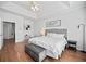 Charming bedroom featuring ensuite, white linens and stylish furnishings at 8540 Hope Mews Ct, Atlanta, GA 30350