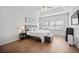 Bright bedroom boasts tray ceilings, large window, and stylish decor at 8540 Hope Mews Ct, Atlanta, GA 30350