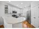 Modern kitchen with white cabinets, stainless steel appliances, and a breakfast bar at 8540 Hope Mews Ct, Atlanta, GA 30350