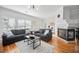 Bright living room with hardwood floors, fireplace, and views of the dining area at 8540 Hope Mews Ct, Atlanta, GA 30350