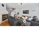 Inviting living room features a fireplace, hardwood floors and staircase access at 8540 Hope Mews Ct, Atlanta, GA 30350