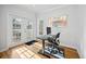 Bright office with hardwood floors, light-filled windows, and walk out to balcony at 8540 Hope Mews Ct, Atlanta, GA 30350