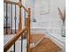 Staircase with wood and iron banisters leads to the upper level of the home at 8540 Hope Mews Ct, Atlanta, GA 30350