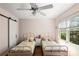 Charming bedroom with twin beds, neutral walls, and wood floors at 2316 Defoors Ferry Nw Rd, Atlanta, GA 30318