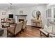 Living room featuring hardwood floors, fireplace, comfortable seating, and stylish decor at 2316 Defoors Ferry Nw Rd, Atlanta, GA 30318