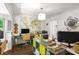 Home office featuring hardwood floors, natural light, modern furniture, and unique wall art, inspiring productivity at 2316 Defoors Ferry Nw Rd, Atlanta, GA 30318